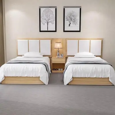 a bedroom with two beds and two pictures on the wall at Luxor temple view in Luxor
