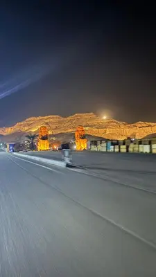 aphalt road at night with mountains in the background at Luxor temple view in Luxor