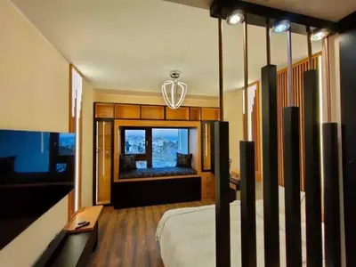 a bedroom with a bed and a large window at Chalet in Hurghada