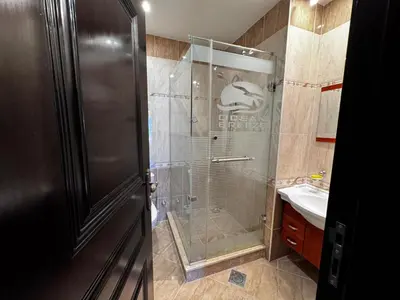 a bathroom with a shower and a sink at Gravity Apartments Sea View Pool View للأجانب فقط Just For Foreigners in Hurghada