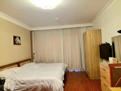 a hotel room with a bed and a television at استديو ايجار في الغردقه 206 in Hurghada