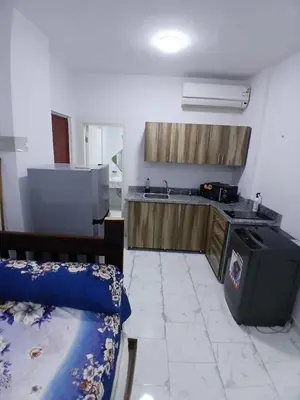 a kitchen with a sink and a stove in a room at Studio in turtels beach e41 in Hurghada