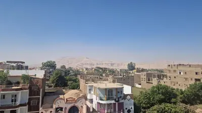 a view of a village with mountains in the background at Villa Joanna in Luxor