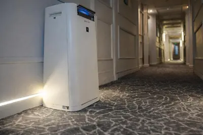 a small white refrigerator sitting in a hallway at Five-Stars Deluxe River Kruz from Aswan to Luxor 3 Nights in Aswān