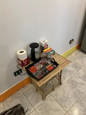 a coffee table in a corner of a room at NubaNest GuestHouse in Aswan
