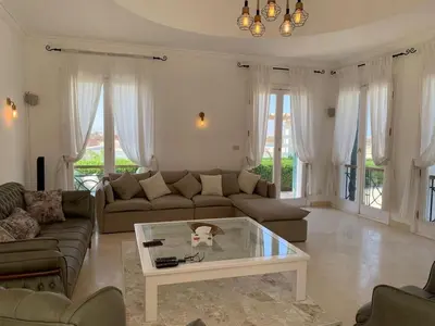a living room with a couch and a coffee table at Unique Hill Villa 3 BD In Gouna in Hurghada