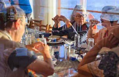 a group of people sitting around a table at Cobra Nile Sails - Tranquility in Luxor