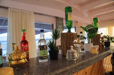 a bar with bottles of alcohol on a counter at Cobra Nile Sails - Tranquility in Luxor