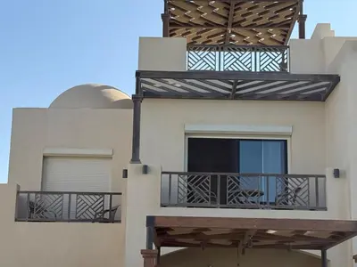 a building with balconies on the side of it at Makadi Heights Resort in Hurghada