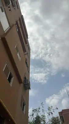 a tall building with balconies on the side of it at Diebo in Aswan
