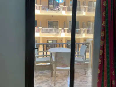 a view of a balcony with a table and chairs at One-Bedroom Chalet at Turtles Beach Resort , Pool & Side Sea View C22 in Hurghada