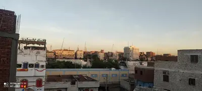 a view of a city skyline with buildings at SolNest Guest House in Jazīrat Aswān