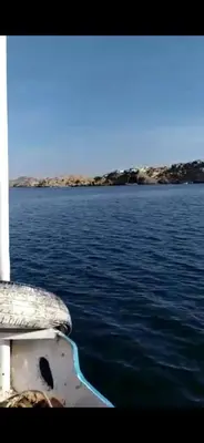 a boat on a body of water at Aswan in Naj‘ al Maḩaţţah