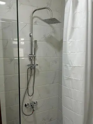 a bathroom with a shower with a glass door at Large Studio Beach & Pool Hurghada - Wifi in Hurghada