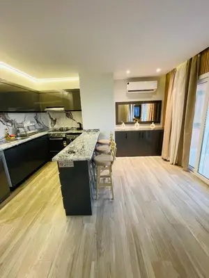 a kitchen with a large island in a room at New Marina Luxury Suite in Hurghada