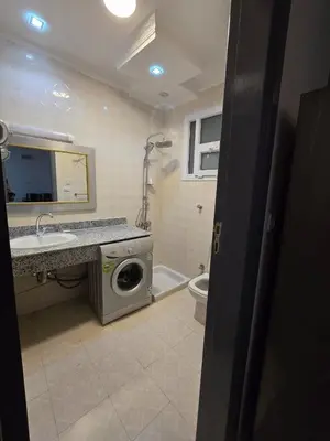 a bathroom with a washing machine and a sink at مصر in Hurghada
