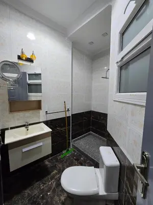 a bathroom with a toilet and a sink at مصر in Hurghada