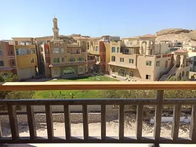 a view of a city from a balcony at Aldau Heights Hurghada in Hurghada