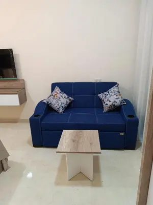 a blue couch in a living room with a coffee table at Hurghada Sea view with pool in Hurghada