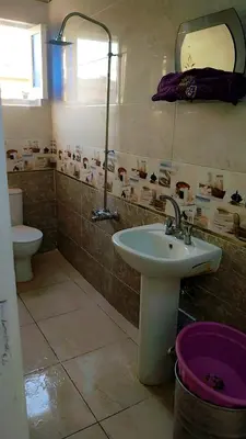 a bathroom with a sink and a toilet at Atlas Aswan Apartment Near Nile Corniche and Old Tourist Market شقة أطلس أسوان بجوار كورنيش النيل والسوق السياحي القديم in Aswan