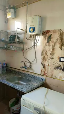 a bathroom with a sink and a counter top at Atlas Aswan Apartment Near Nile Corniche and Old Tourist Market شقة أطلس أسوان بجوار كورنيش النيل والسوق السياحي القديم in Aswan