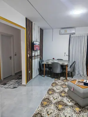 a living room with a couch and a table at THE BESt in Hurghada