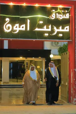 two people dressed in costumes standing outside of a building at فندق ميريت امون سوهاج in Jazīrat Maḩrūs