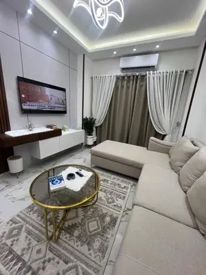 a living room with a couch and a table at La Bela Resort in Hurghada