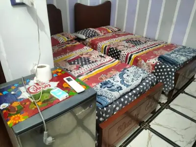 a couple of beds sitting next to each other at Safy Guest House in Aswan
