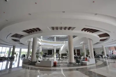 a large white building with columns and a ceiling at Xanadu Club Makadi Bay - High Class All Inclusive in Hurghada