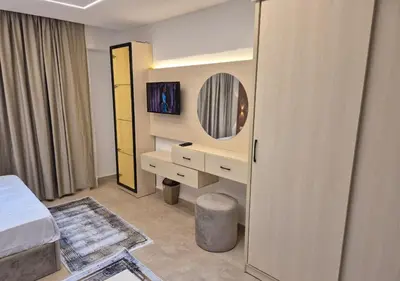 a hotel room with a bed and a mirror at Bay View Sahl Hasheesh Chalet in Hurghada