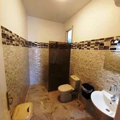 a bathroom with a toilet and a sink and a shower at family villa private pool in Luxor