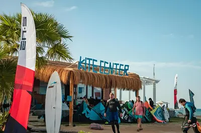 a group of surfers standing in front of a surf shop at Arena Beach Resort in Hurghada