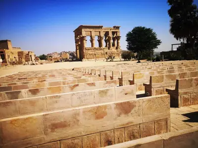 a large amphitheater with a building in the background at Katadool Boat in Aswan