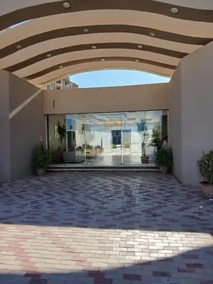 an empty courtyard of a building with a vaulted ceiling at Princess resort in Hurghada