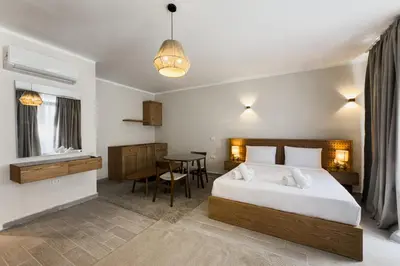a bedroom with a large bed and a table at Elegance Serene 3 BDR Townhouse w Private Pool Bali Gouna in Hurghada