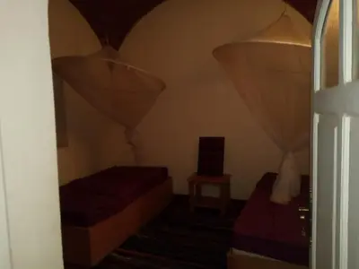 a small room with two beds and a window at جزيره سهيل in Aswan