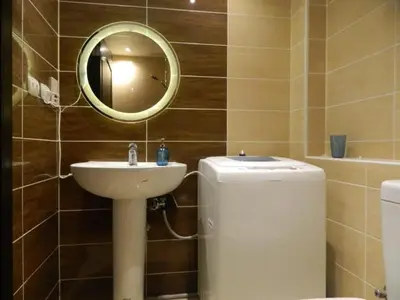 a bathroom with a sink and a mirror and a toilet at Florenza Khamsin Nor in Hurghada