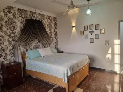 a bedroom with a bed with a canopy at Adream partment in Luxor in Luxor