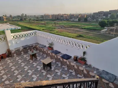 a balcony of a building with a table on it at Adream partment in Luxor in Luxor