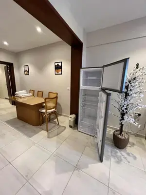 an office with an open refrigerator and a desk at La Blanca in Hurghada