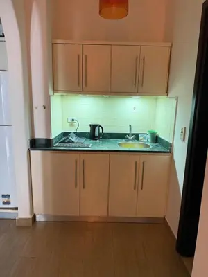 a kitchen with a sink and a counter top at Red Sea Horizon in Hurghada