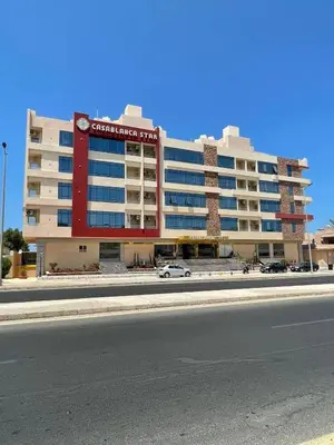 a large building on the side of a street at كازابلانكا ستار in Hurghada