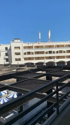 a large building in front of a building at Hurghada concierge at La Prestigia B2 4 in Hurghada