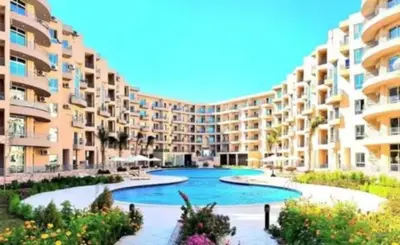 a large apartment building with a large swimming pool at Princess resort217 in Hurghada