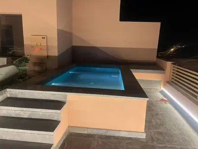a swimming pool in a building with stairs at Stunning 3 bd penthouse with private pool - El Gouna in El Gouna