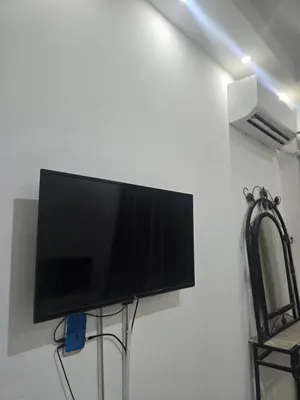 a flat screen tv hanging on a wall at Florenza Khamsin Sea front in Hurghada