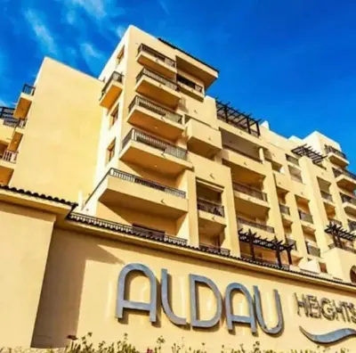 a building with an adaq sign in front of it at Aldau heights Hurghada in Hurghada