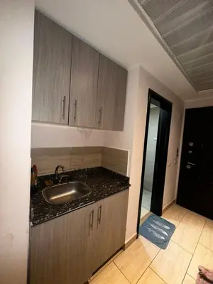 a kitchen with a sink and a counter top at Aldau heights Hurghada in Hurghada