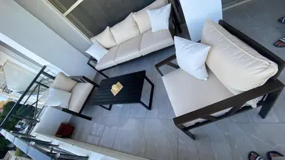 an overhead view of a living room with a couch and pillows at Sea view 3 bedrooms apartment 06 in Hurghada